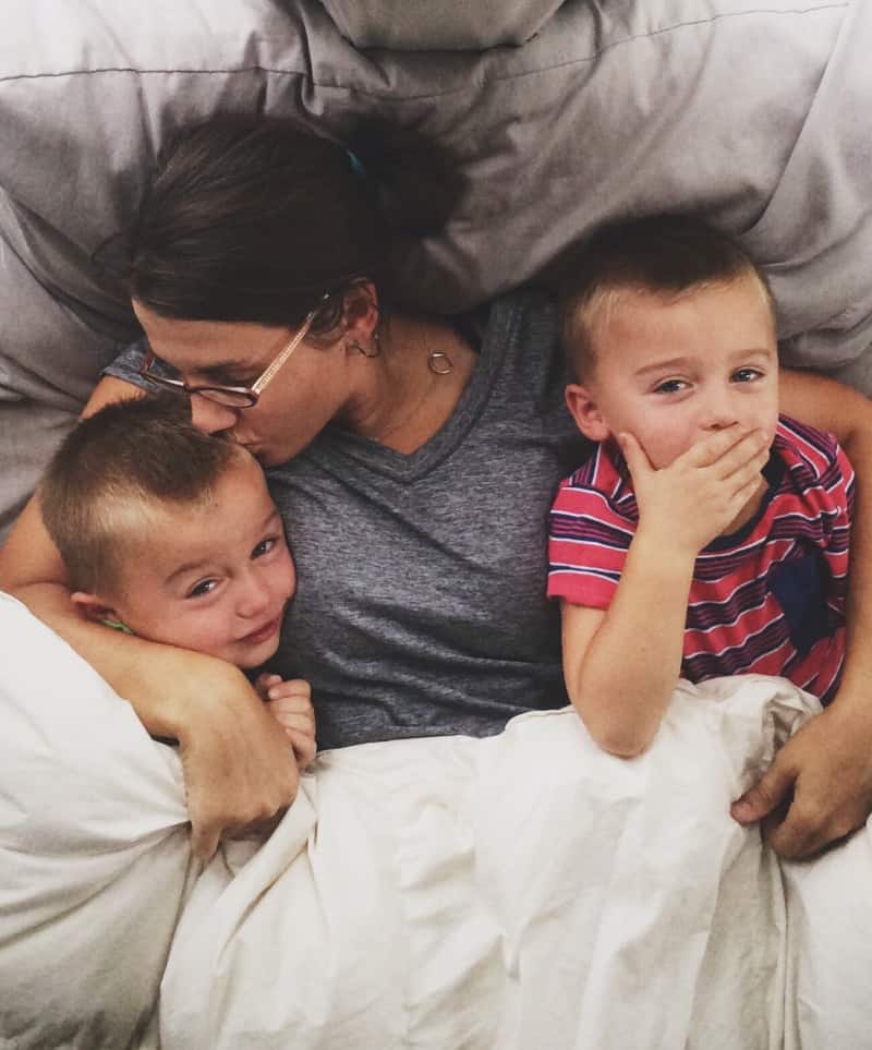 Single mom and kids hanging out in bed